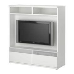 a white entertainment center with a flat screen tv mounted on it's side wall