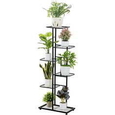 a tall black metal plant stand with potted plants on it's sides and four shelves