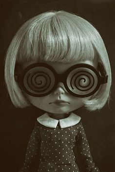 an image of a doll with big glasses on it's eyes and blonde hair