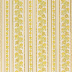 a yellow and white striped wallpaper with flowers on the side, in an ornate pattern