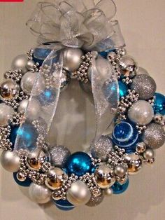 a blue and silver christmas ornament wreath