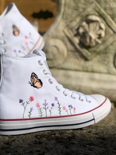 These custom Converse trainers are embroidered by hand on the outside  to create a completely unique pair of shoes.   I only purchase 100% genuine shoes from the official converse website. Sizes are in standard woman UK sizes. **Because each pair of trainers are made to order I do not provide refunds if the shoes do not fit, so be sure that you have ordered the correct size.** Please check my processing times before placing an order as it can vary depending on my current workload. However, if you need them in a quicker time frame then don't hesitate to send me a message to see if I can prioritise your order if you have a specific deadline that needs to be met. If you have any custom requests for different designs then feel free to send a message and I can see what I can do. Thanks for look Casual Sneakers With Custom Embroidery, Casual Custom Embroidery Lace-up Sneakers, Casual Sneakers With Custom Embroidery For Spring, White Sneakers With Appliques For Summer, Casual High-top Sneakers With Custom Embroidery, Converse Butterfly, Converse Embroidery, Cute Converse Shoes, Embroidered Converse