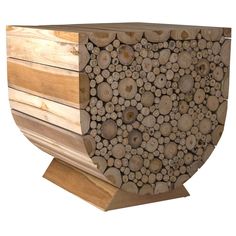 a large stack of wood logs stacked on top of each other in front of a white background