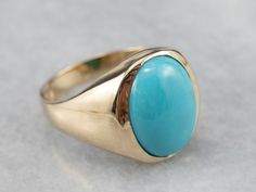 This vintage yellow gold ring dates to the Mid Century period, with sleek lines and a lack of adornment. The very simple design means that the beauty of the ring is dependent on the balance and polish of its golden frame. A simple bezel surrounds the stone, and really helps to set off the gorgeous teal coloring of the turquoise! Metal: 10K Yellow Gold Gem: Turquoise Gem Measurements: 15.4 x 11.4 mm, Oval Ring Size: 10.75 Marks: "10K" Stamped on the inside band Ring Blue Stone, Turquoise Gem, Turquoise Belt, Turquoise Gold Ring, Right Hand Ring, Nugget Necklace, Golden Frame, Turquoise Accents, Ring Turquoise