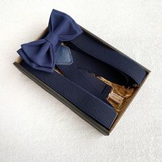 Navy bow tie and suspenders Wedding navy blue bow tie Groomsmen bow tie The bow tie is packaged in a wonderful kraft box with a beautiful bow. You will have a perfect and unique gift! The bow tie is handmade and created with huge love! Colors will suit costumes and everyday outfits. Size Adult bow tie 4,5x2,5 inch (11,5x6,5 cm) Neck 14 - 20,5 inch (35,5 - 52 cm ) Size Teenager 3,5 x 1,5 inches ( 9 x 3,8 cm) Size Baby 3 x 1 inches ( 7,5 x 3 cm) The size of the neck is adjustable Suspenders for ad Navy Blue Suspenders Groomsmen, Tie And Suspenders Wedding, Bow Tie And Suspenders Wedding, Navy Blue Suspenders, Wedding Navy Blue, Groom Bow Tie, Bow Tie Groomsmen, Navy Blue Bow Tie, Navy Bow Tie