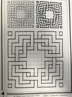 a black and white photo of mazes on a sheet of paper with an arrow in the middle