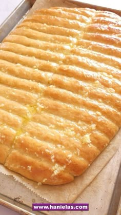 a loaf of bread sitting on top of a pan