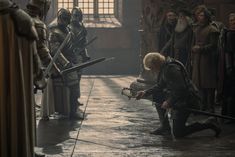 game of thrones season 3 episode 2 scene with the king kneeling down in front of his staff