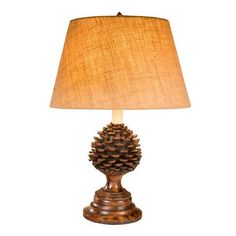 a pine cone lamp on a white background