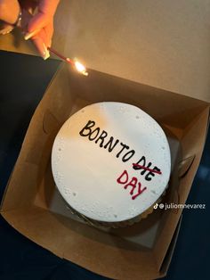 a birthday cake in a box with writing on it