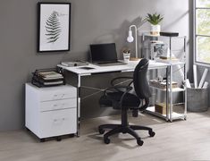 an office with a desk, chair and computer on the table in front of a window