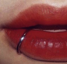 a woman's lips with red lipstick on them