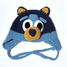 a crocheted hat with a bear face on it