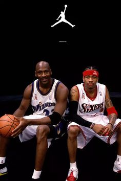 two basketball players sitting next to each other