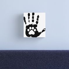 a black and white hand print with paw prints on the inside of it canvas print