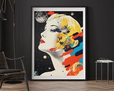 a framed art print of a woman's face with planets in the background