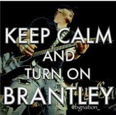 a man playing an electric guitar with the words keep calm and turn on brantley