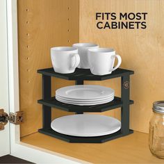 three tiered shelves holding plates and cups