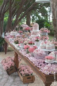 a table filled with lots of desserts and cupcakes on top of it