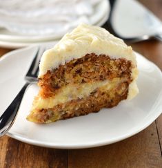 a piece of carrot cake on a white plate