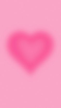 a heart shaped object on a pink background