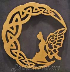 an image of a person in the middle of a circle with celtic designs on it