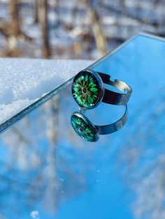 This is a handcrafted adjustable flower resin ring! I created this ring with a adjustable stainless steel bezel ring! I have added a real greenish-blue flower! And filled with clear epoxy resin! This ring will make a great gift or a great addition to your collection! *The item on the photos is only a sample and you will receive a similar item with the same good quality! *Due to different monitors the colors may vary slightly! Gift packaging is included! Free domestic shipping on orders of $35 or Resin Rings, Rings Blue, Clear Epoxy Resin, Flower Resin, Clear Epoxy, Bezel Ring, Resin Ring, Greenish Blue, Jewelry Maker