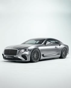 a silver sports car on a white background