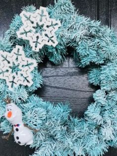 a christmas wreath with snowflakes on it