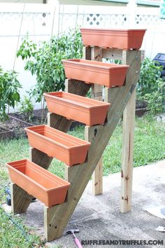 a set of wooden steps with planters on them