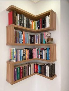 the bookshelf is made out of wood and has three shelves filled with books