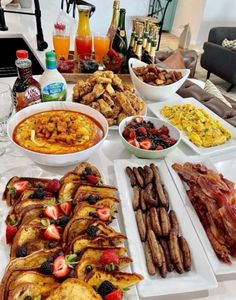 a table filled with different types of food and drinks on top of eachother