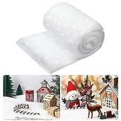 two rolls of white christmas wrapping paper next to a photo of a snowman and reindeer