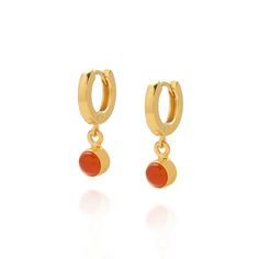 With their bright Orange hues these Carnelian Birthstone Gem Hoop Earrings will add colour and elegance to any look. Perfect for any July born as a personal gift. With artisan gem set detailing and hung from a modern sterling silver ear hoop. Show off your style whilst enjoying their reputed healing properties. Carnelian: stimulate creativity | motivate | reduce fatigue We want your jewellery to stay in great condition so you can enjoy it for years to come. With some simple steps you can help prolong the life of your pieces. Remove your jewellery daily, put it on as the last step when getting ready and the first thing you take off at the end of the day. Avoid spraying with perfume and contact with creams and lotions and do not wear in water. When not being worn jewellery can be prone to ta Orange Gem, Birthstone Gems, Orange Jewelry, Orange Crystals, Zodiac Jewelry, July Birthstone, Birthstone Earring, Orange Gold, Silver Pieces