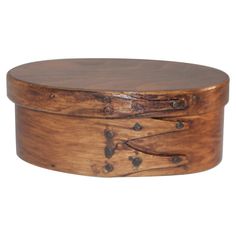 a round wooden box with two drawers