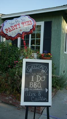 a chalkboard sign in front of a building