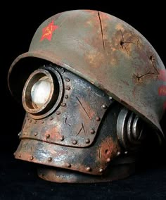 an old metal helmet with a light on it