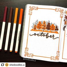 an open notebook with some markers and pens on the table next to it is a drawing book that says october