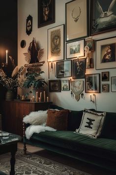 a living room filled with lots of pictures on the wall