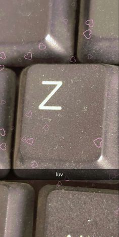 a computer keyboard with the letter z on it's left side and hearts all over the keys