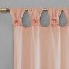 the curtains are hanging in front of the window with pink flowers on them and gold hardware