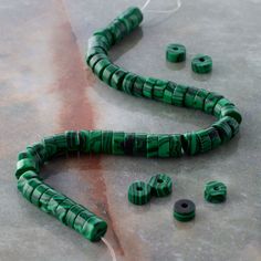 "Find the Green Reconstituted Stone Heishi Beads by Bead Landing™ at Michaels. These pretty green heishi beads made to look like malachite will add eye-catching appeal to your accessory creations. On their own or mixed with complementary beads and charms, these beads will make lovely necklaces, bracelets and earrings. These pretty green heishi beads made to look like malachite will add eye-catching appeal to your accessory creations. On their own or mixed with complementary beads and charms, the Bead Landing, Green Beads, Pretty Green, Heishi Beads, Lovely Necklace, Green Bead, How To Make Beads, Necklaces Bracelets, Natural Stones