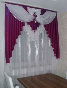 a dining room table with white chairs and purple curtains