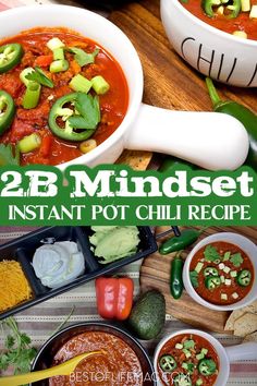 two white bowls filled with chili and green peppers next to tortilla chips on a wooden table