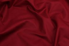 a close up view of a red fabric