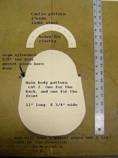 a piece of paper cut out to look like a handbag with measurements on it