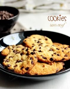 chocolate chip cookies in a black bowl on a table