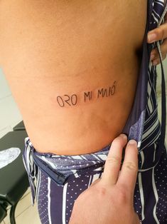 a person with a tattoo on their stomach that says,'i am 90 '