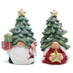 two small christmas trees with santa claus and a star on each tree, one holding a present