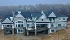 an aerial view of a large house with lots of windows